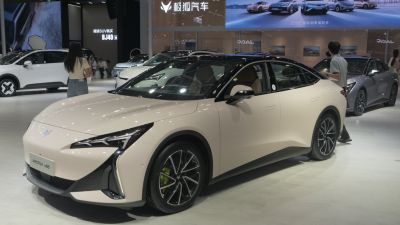 Electric sedan with aerodynamic body and LED headlights