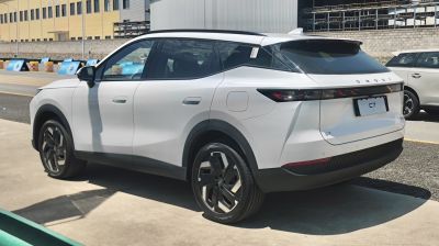 Rear-side view of a white SUV with sharp LED taillights and alloy wheels
