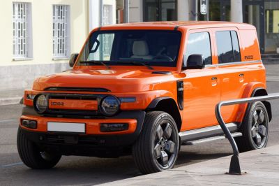 Boxy SUV with round headlights and bold front grille