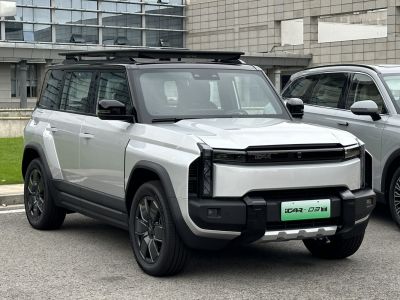 Front view of modern electric SUV with roof rack.