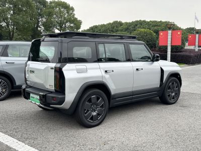 Rear-side view of modern SUV with roof rails and black rims