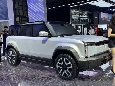 Angular LED headlights and rugged tires on a boxy SUV.