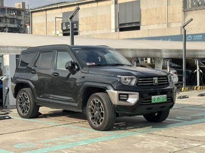 Robust black SUV with angular design, front and side view