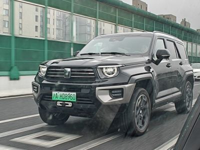 Black SUV with modern LED headlights and robust grille on road