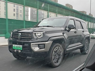 Black modern SUV front with distinctive headlamps and robust grille