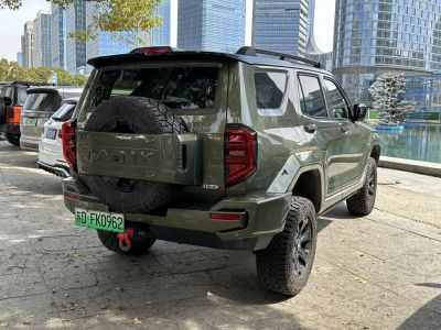 SUV rear view with mounted spare tire and rugged off-road tires