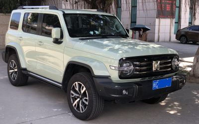 Round headlights with LED bars and multi-spoke alloy wheels on rugged SUV