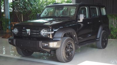Modern SUV with round headlights and bold grille.