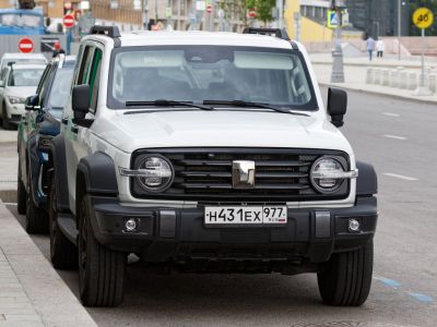 Front view of SUV with round headlights and rugged grille