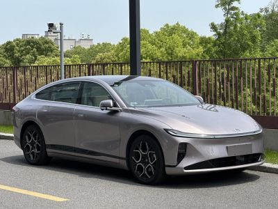 Sleek modern electric sedan with aerodynamic body and futuristic wheels