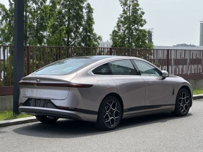Rear view with continuous LED taillight and aerodynamic sedan body