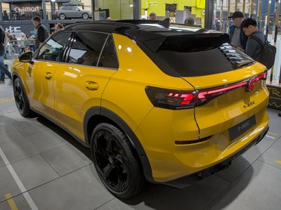 Yellow SUV rear and side view with LED taillights and black alloy wheels