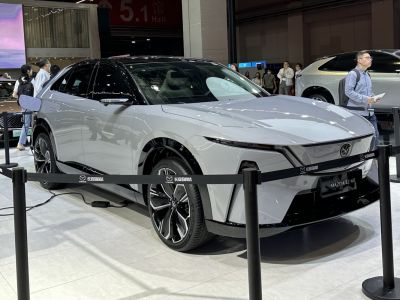Electric SUV with aerodynamic shape and distinctive LED headlights