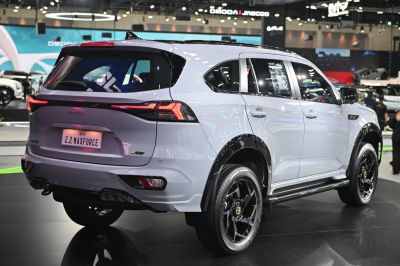 SUV rear and side view with distinctive taillights and black wheels