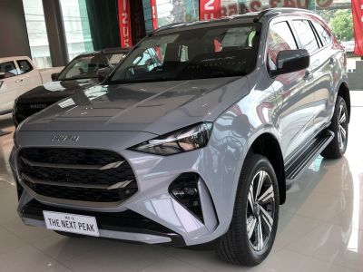 Close-up of front grille and LED headlights with chrome accents.