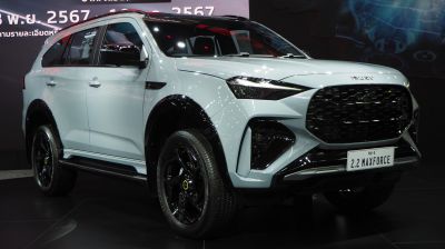 Front fascia with aggressive grille and sleek side profile of an SUV