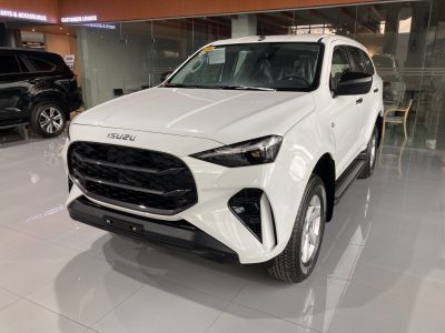 Front view with black honeycomb grille and angular headlights