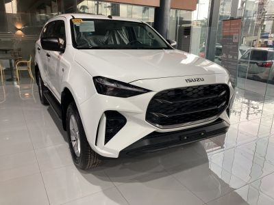 Front grille and sleek sharp headlights of modern SUV