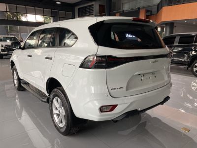 White mid-size SUV rear and side with modern tail lights