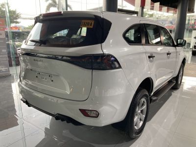 Rear view and side profile of a modern white SUV with sleek tail lights