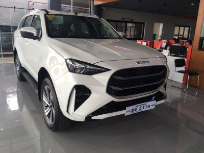 Prominent black front grille with sleek aerodynamic headlights