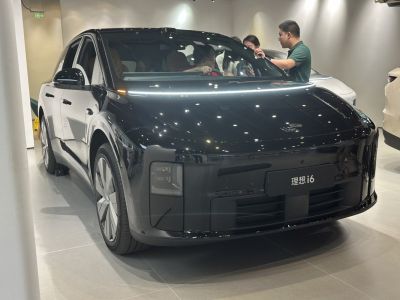 Smooth front SUV with distinctive square LED headlights and aerodynamic design