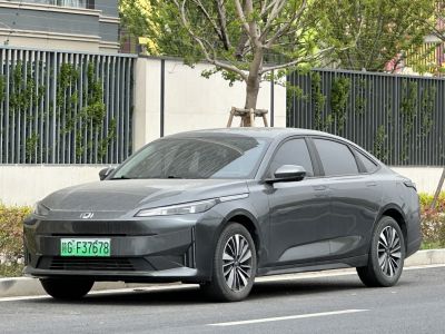 Electric sedan with sharp LED headlights and aerodynamic design
