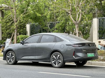 Side and rear of a sleek modern sedan with aerodynamic design and LED taillights