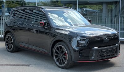 Front and side view of a sleek black compact electric SUV with LED headlights and alloy wheels