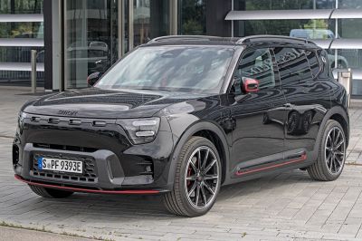 Front side view of an electric SUV with LED headlights and aerodynamic design.