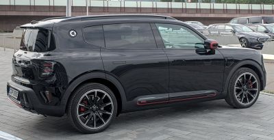 Black modern SUV with tinted windows and sporty alloy wheels