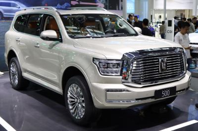 Luxury SUV with large chrome grille and LED headlights