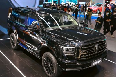 Black large SUV with bold front grille and LED headlights