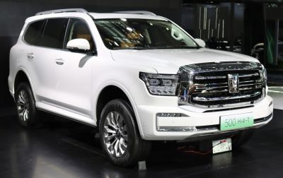 Front grille and LED headlights of a white luxury SUV
