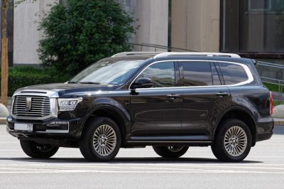Luxury full-size SUV with large chrome grille and alloy wheels