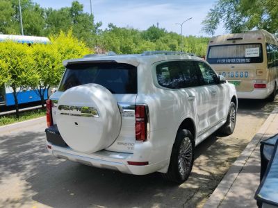 SUV rear view with spare wheel cover and vertical taillights