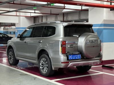 Rear side view of SUV with spare tire and vertical taillights
