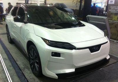 Electric SUV front angle with sleek LED headlights and aerodynamic body.