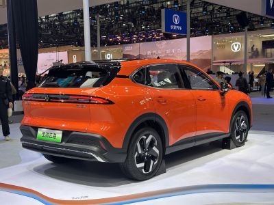 Rear view of orange crossover with black roof and LED light strip