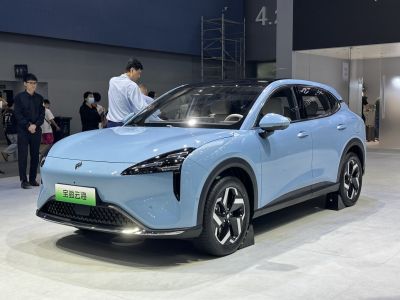 Sleek front side view of a modern electric SUV with aerodynamic styling.