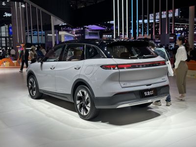Sleek rear design with continuous LED lights and modern side profile of SUV