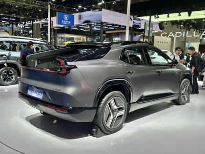 Sleek rear design with distinctive tail lights and modern wheel design