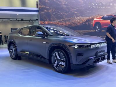Futuristic electric SUV with LED light bar and sleek body design