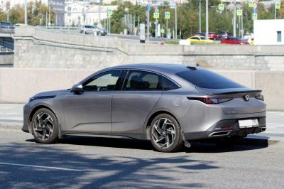 Sleek sedan exterior with distinctive alloy wheels and aerodynamic shape