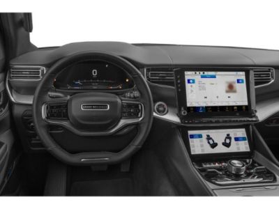 Dashboard with dual infotainment screens and multifunction steering wheel