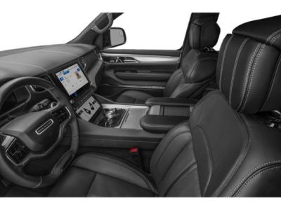 Luxury SUV interior with leather seats and dual digital displays