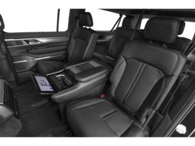 Spacious rear leather seats with touchscreen and armrest console