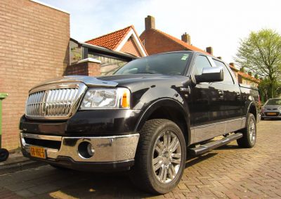 Front chrome grille and alloy wheels on full-size pickup