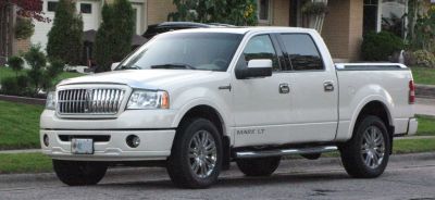 Luxury pickup with chrome grille and crew cab