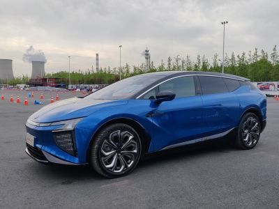 Electric SUV side profile with sleek aerodynamic design and blue body.
